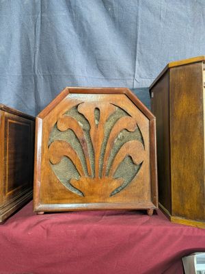 three wooden boxes that are sitting on a table