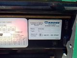 a close up of a green machine with a lot of information on it