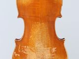 an old violin with a wooden back and bow on a white background
