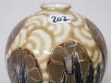 a vase that is sitting on a white table