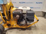 an image of a small machine that is parked in a garage