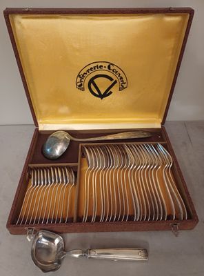 a wooden box with a set of silverware in it
