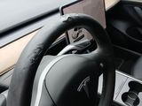a steering wheel and dashboard of a car in a car