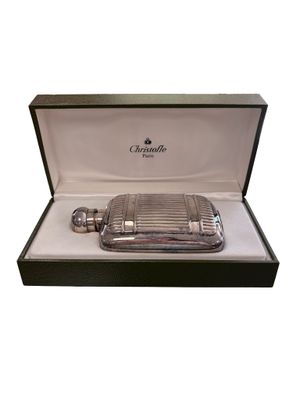 a close up of a silver flaskt in a box on a white background