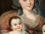 an old painting of a woman and two children sitting in a chair
