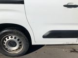 a white van that is parked in the parking lot
