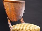 an image of a wooden chair with a yellow upholstered seat