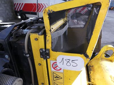 a close up of a yellow construction vehicle with a sign on it