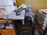 a small desk with a camera and a printer on it