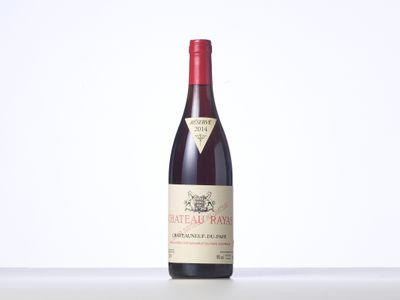a bottle of red wine sitting on top of a table