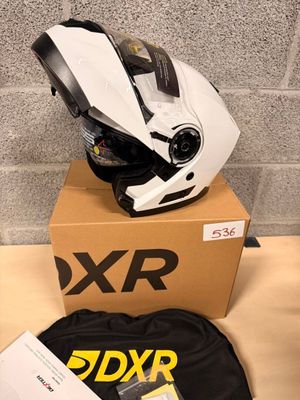 the helmet is sitting on top of the box on the table