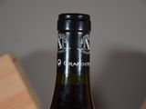 a bottle of wine that is sitting on a table