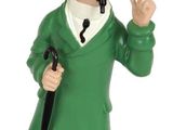 a figurine of a man in a green coat and hat holding a cane