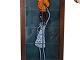 painting of a woman carrying a pot on her head in a wooden frame