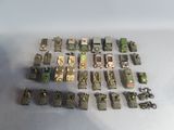 a lot of toy army vehicles that are on the table