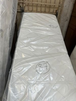 a mattress that has been wrapped up in plastic