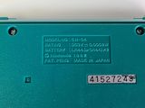 a close up of a blue electronic device on a table