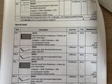 a sheet of paper on a table with a calculator and a calculator on it