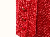 the jacket is red and has buttons on the front