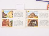an open book with pictures of different places on it