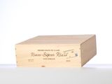 a wooden box that has a wine bottle inside of it