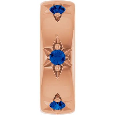 une photo d'une bague en or rose sertie de saphirs bleus