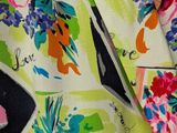a close up of a multicolored floral print fabric