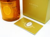 a bottle of whisky sitting next to a box