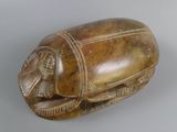 a wooden object with a design on it