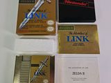 four nintendo game cartridges sitting on a table next to each other