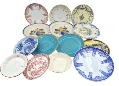 a lot of plates that are sitting on a table