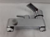 a faucet that is sitting on a white table