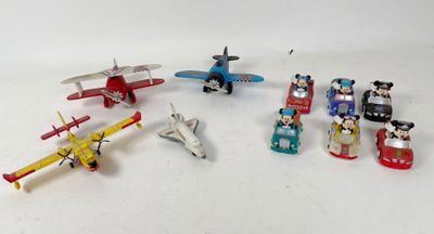 a lot of small toy airplanes on a white surface