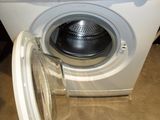 a washing machine that is sitting on the floor