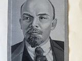 portrait of a man in a suit and tie with a pipe in his mouth