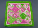 a pink and green square scarf with a green border