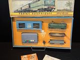 a box with a train set in it on a table