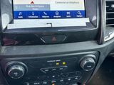 the dashboard of a car with a gps device in the center of it