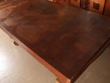 a wooden table that is in the middle of a room