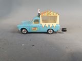 a toy car with a ice cream cone on top of it