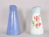 two salt and pepper shakers sitting next to each other
