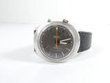 a watch that is sitting on a white surface