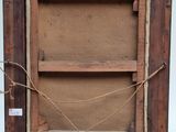 an old wooden easel with a piece of wood on top of it