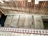 a wooden floor with a tile pattern on the floor