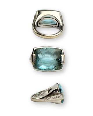 trois types différents de bagues en argent et en pierre bleue sur fond blanc