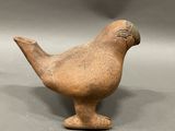 a bird shaped object that is sitting on a table