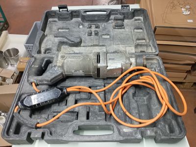 a tool in a case that is sitting on a table