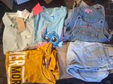 a pile of clothing that is on the floor