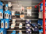 many boxes of electronics on the shelves in the store