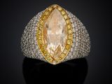 a yellow and white diamond ring with two rows of yellow and white diamonds